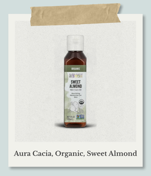 目的,テキスト 代替テキスト,Aura Cacia（オーラカシア）のオーガニックスキンケアオイル、スイートアーモンドオイル（118ml）の遮光ボトル。キャリアオイルや保湿オイルとして使用。ポラロイド風。